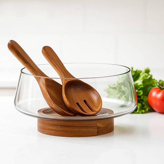 Salad bowl made of glass with wooden base and cutlery
