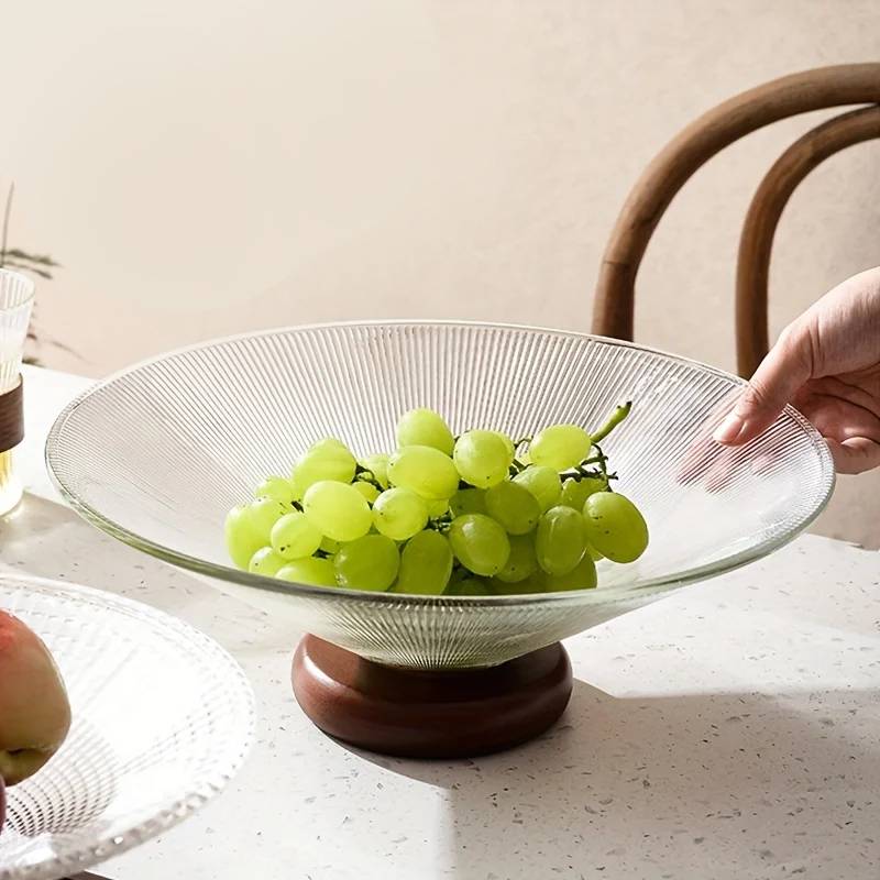 Fruit bowl made of glass with wooden base