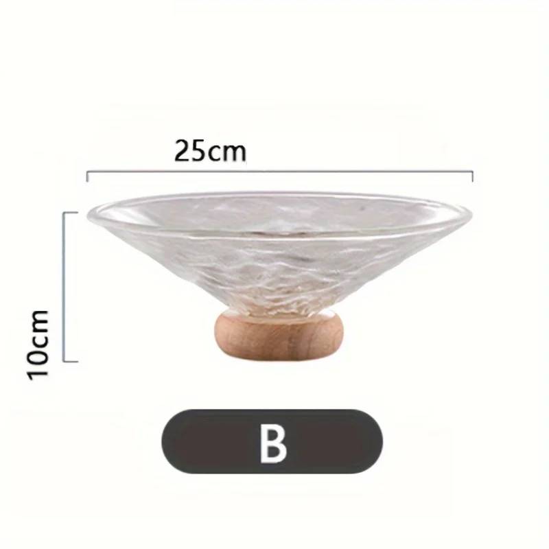 Fruit bowl made of glass with wooden base