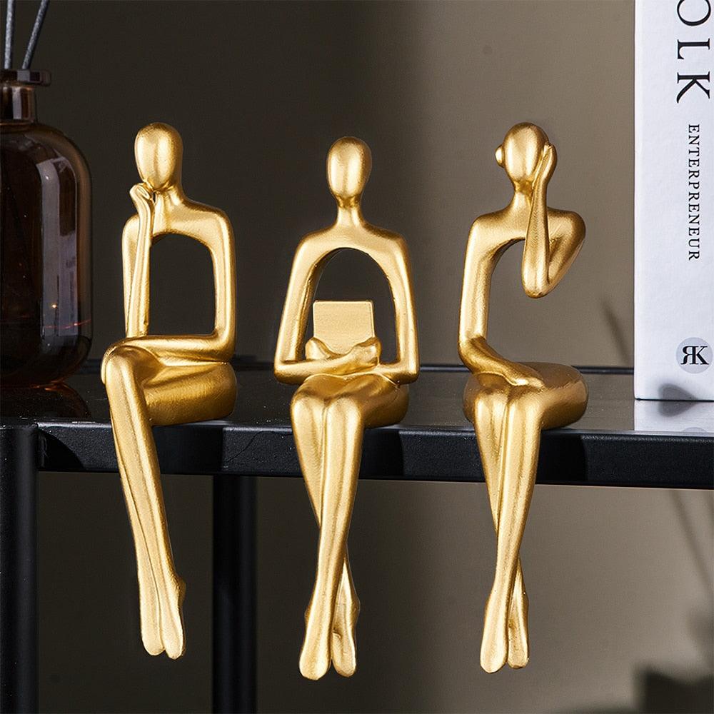 Trio nordico di sculture umane