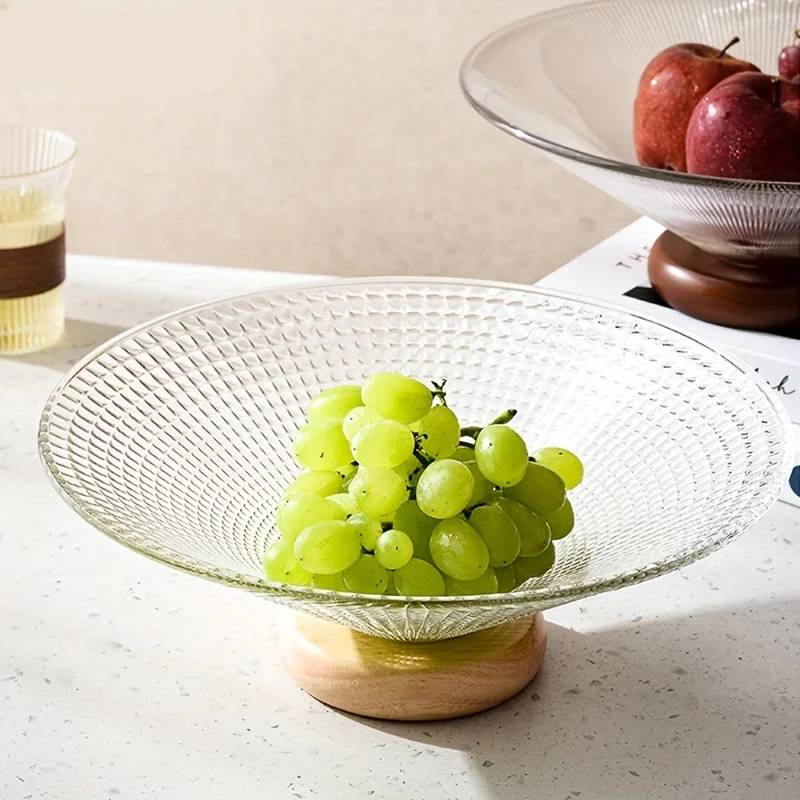 Fruit bowl made of glass with wooden base