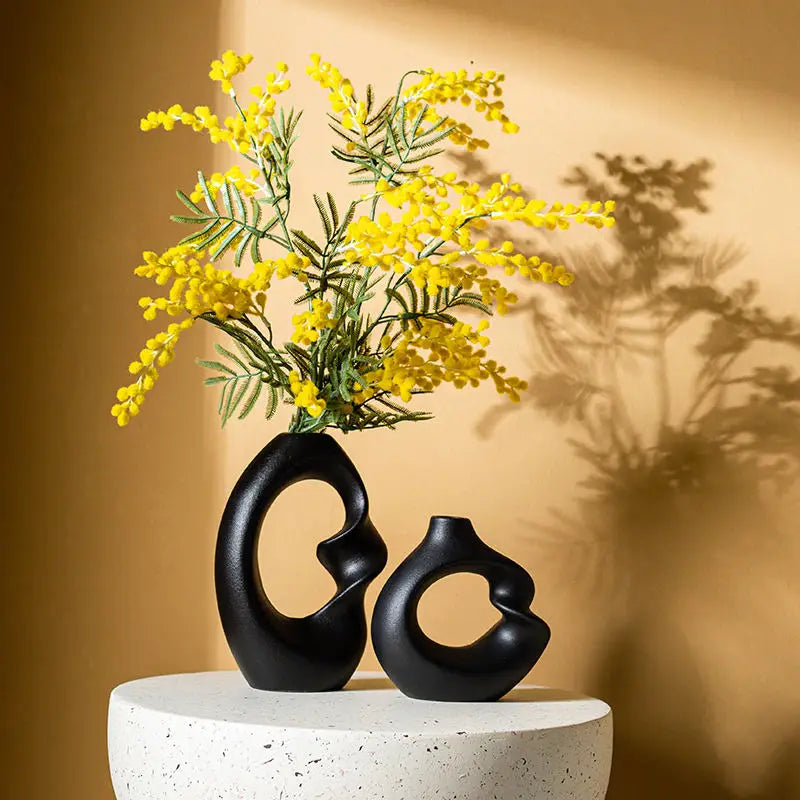 Curved double vase made of ceramic