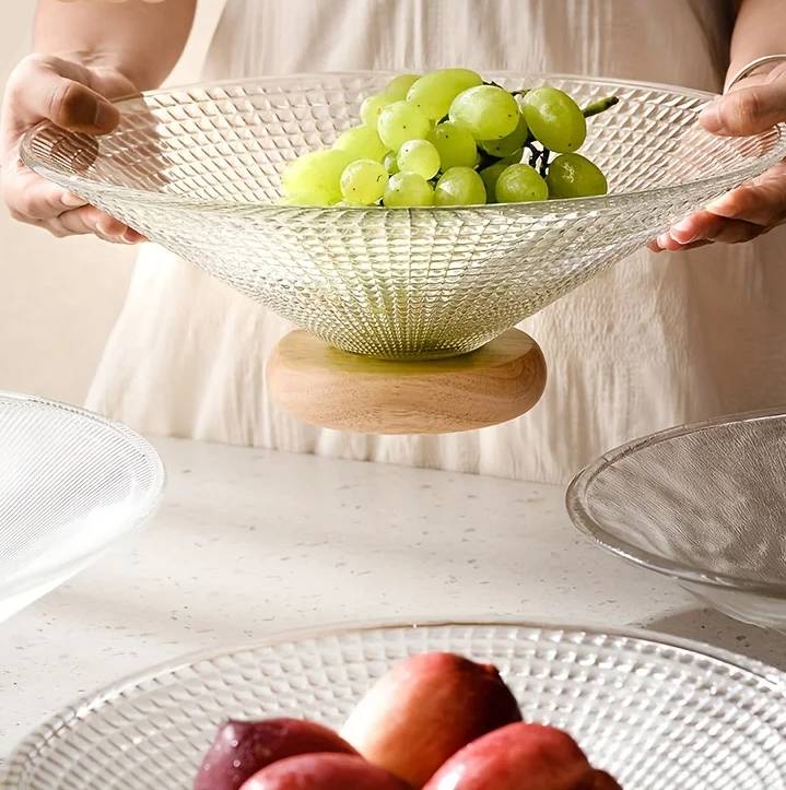 Fruit bowl made of glass with wooden base