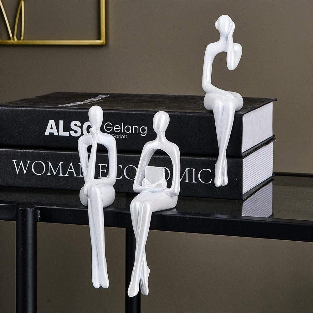 Trio nordico di sculture umane
