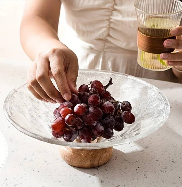 Fruit bowl made of glass with wooden base